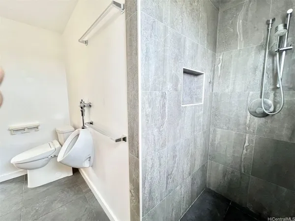 a bathroom with a sink a toilet and mirror