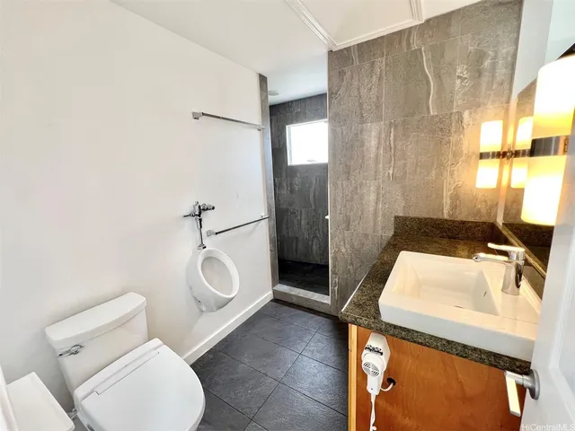 a view of a hallway with wooden floor and stairs