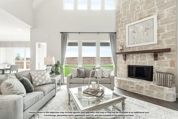 a living room with furniture a rug and a fireplace