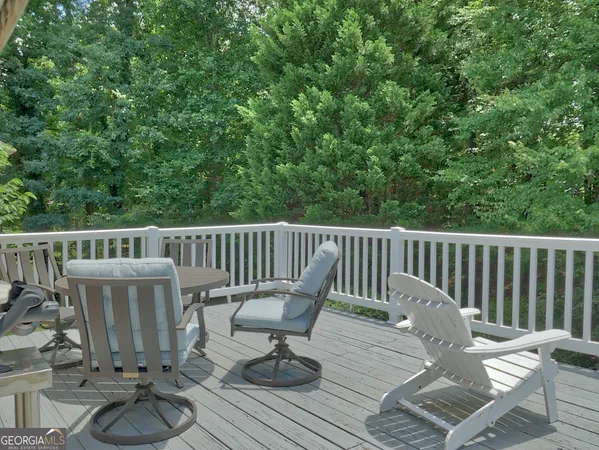 a view of balcony with wooden floor and outdoor seating