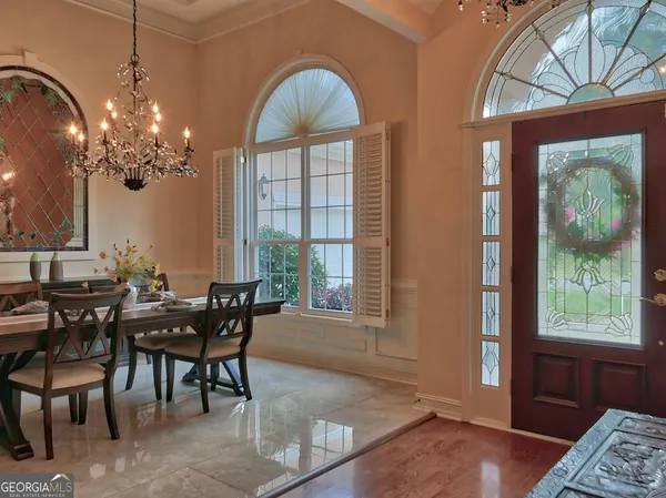 a view of a dining room with furniture window and outside view