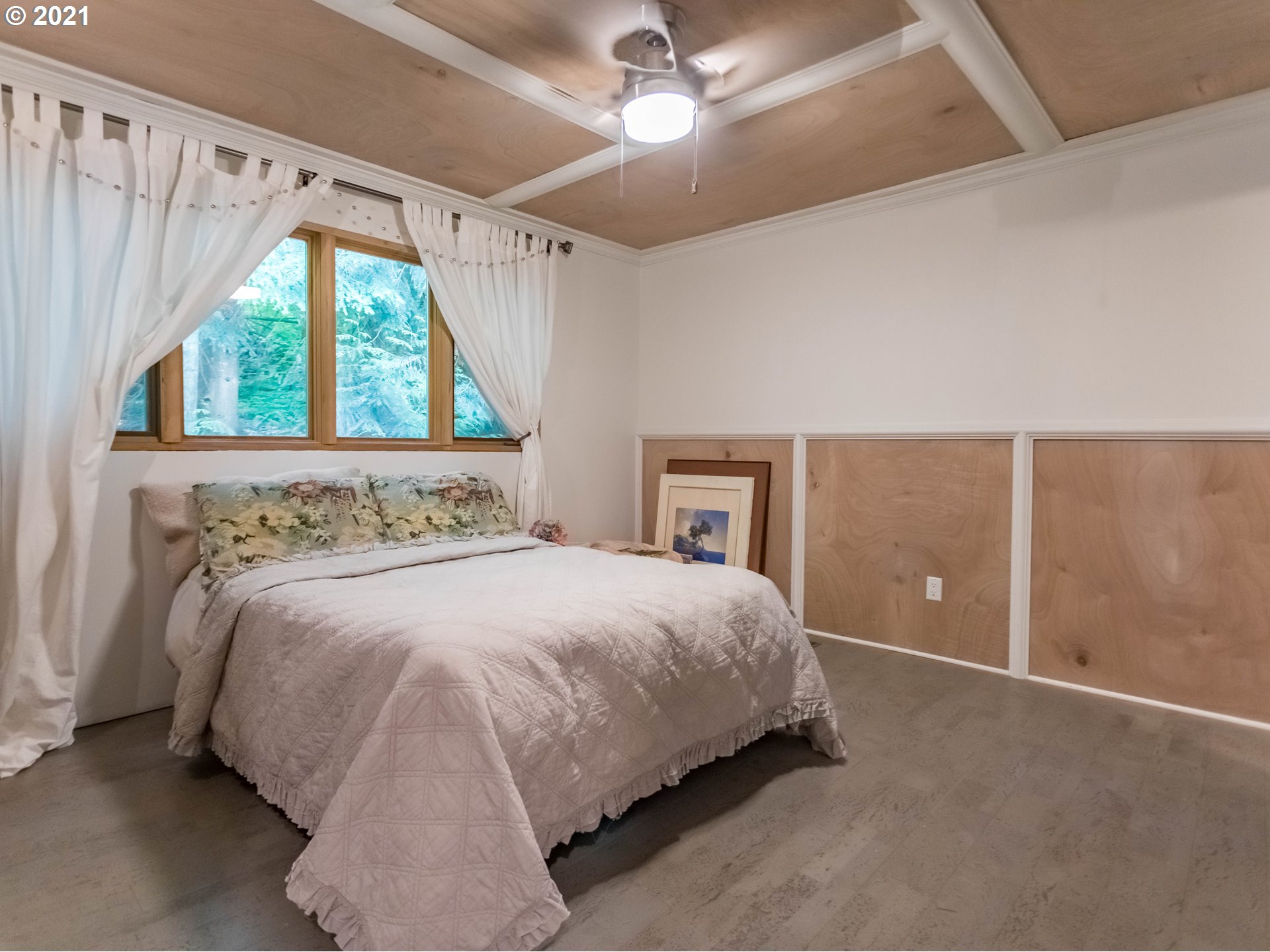 43900 Southeast Keisecker Road Sandy, OR 97055 - Photo 11 of 31 a bedroom with a bed and a chandelier
