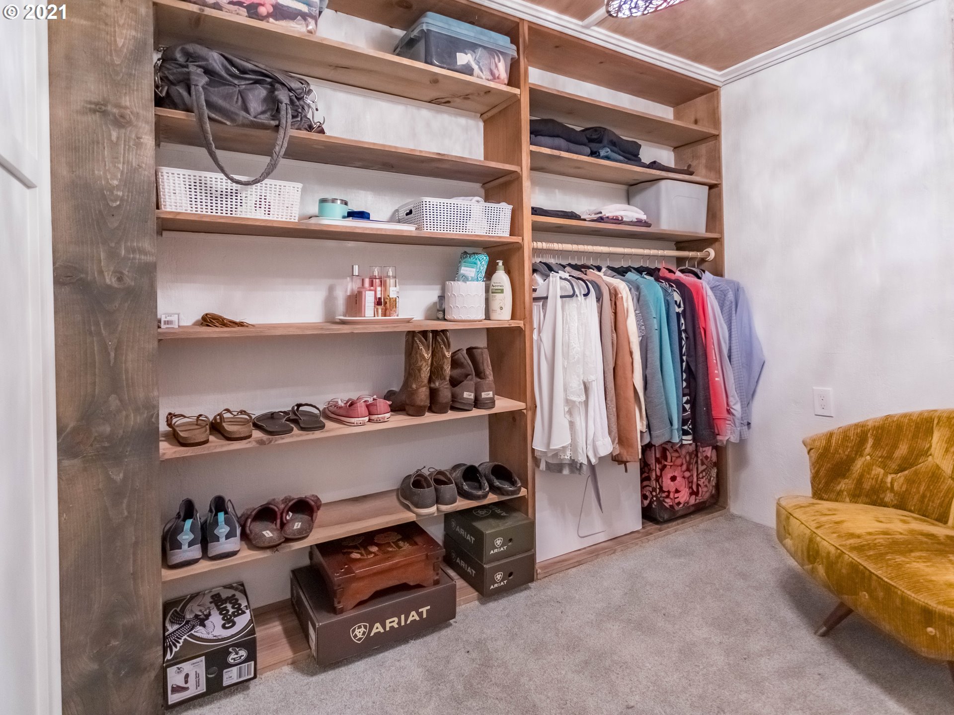 43900 Southeast Keisecker Road Sandy, OR 97055 - Photo 22 of 31 a view of walk in closet with clothes and shoes