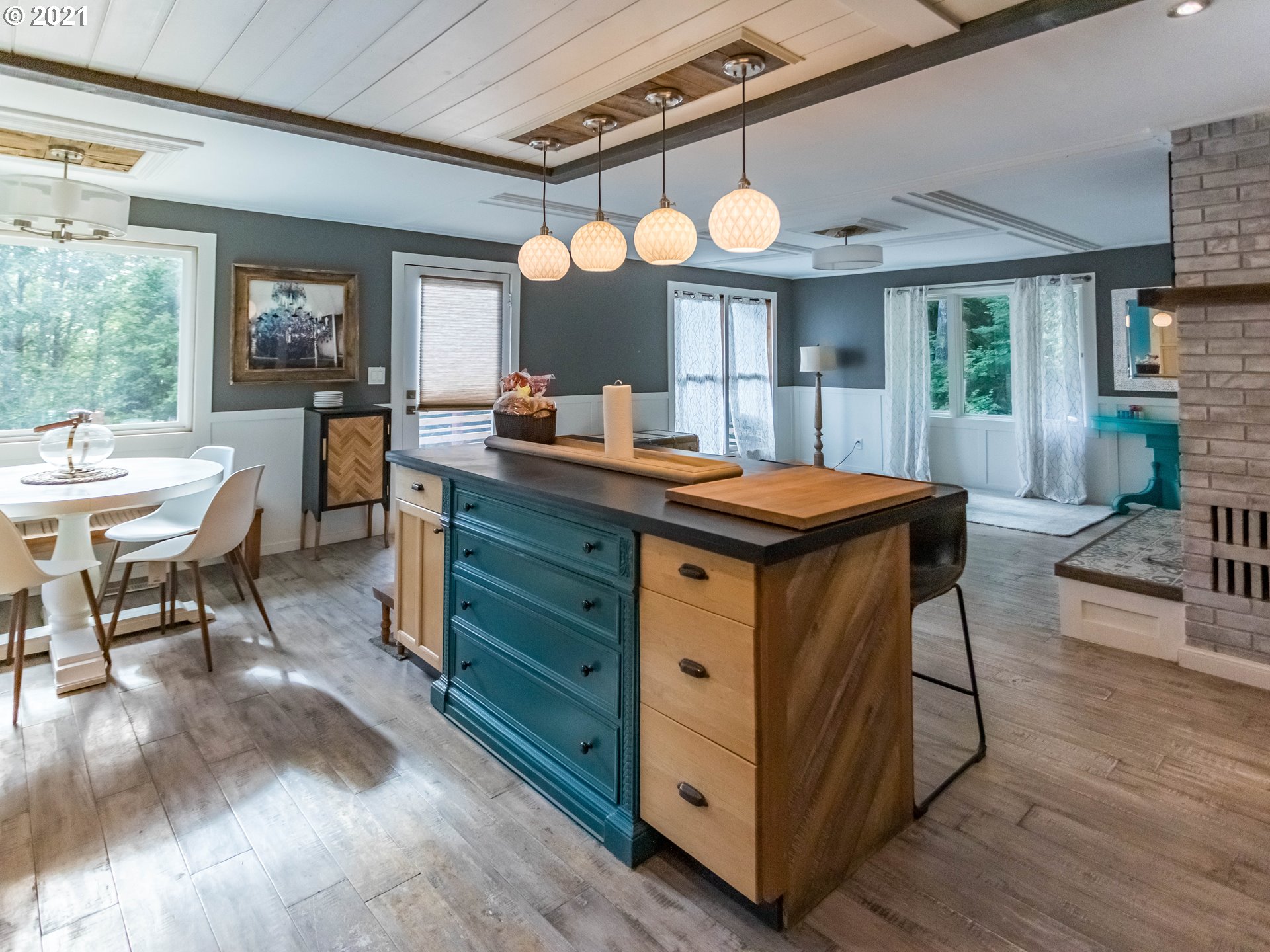 43900 Southeast Keisecker Road Sandy, OR 97055 - Photo 9 of 31 a view of a dining room with furniture a chandelier and wooden floor