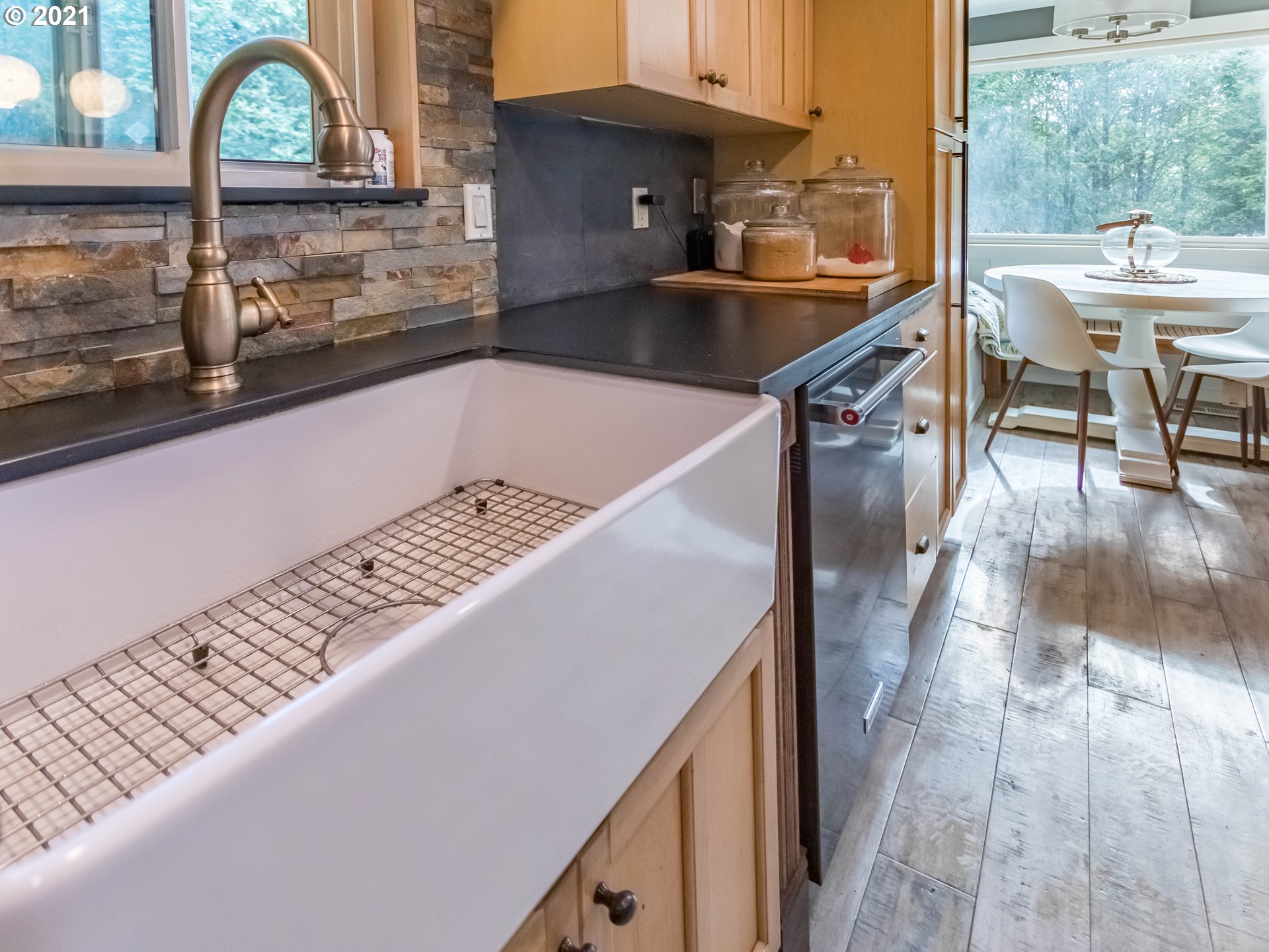 43900 Southeast Keisecker Road Sandy, OR 97055 - Photo 10 of 31 a kitchen with a sink and a stove top oven