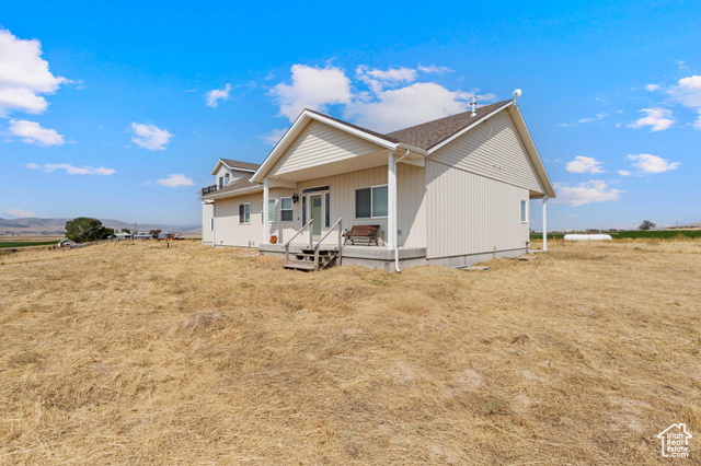 19502 South Olson Road Downey, ID 83234 - Photo 40 of 64 Rear view of house featuring covered porch and a shingled roof
