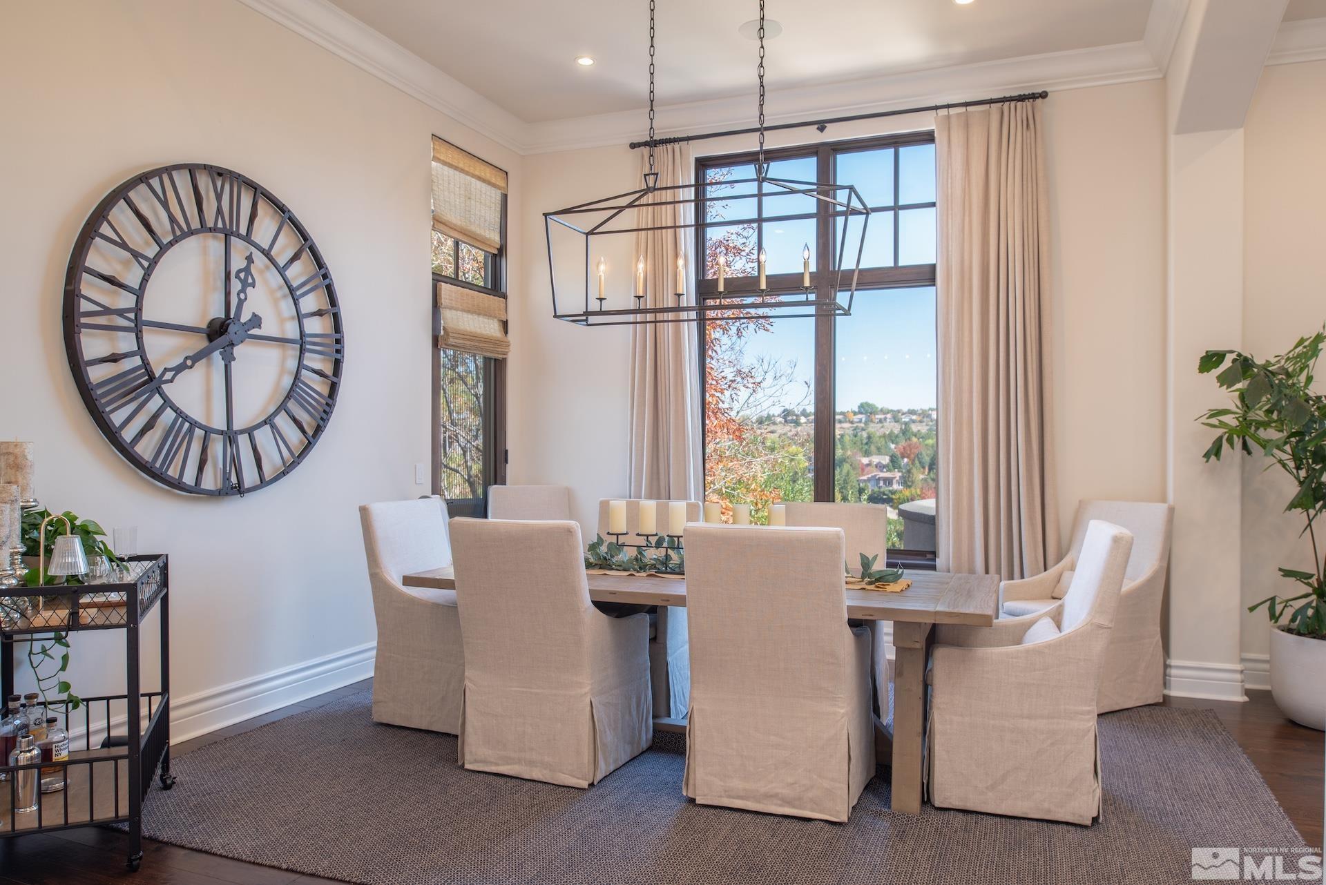 175 Hawken Road Reno, NV 89519 - Photo 12 of 40 a dining room with furniture a potted plant and a chandelier