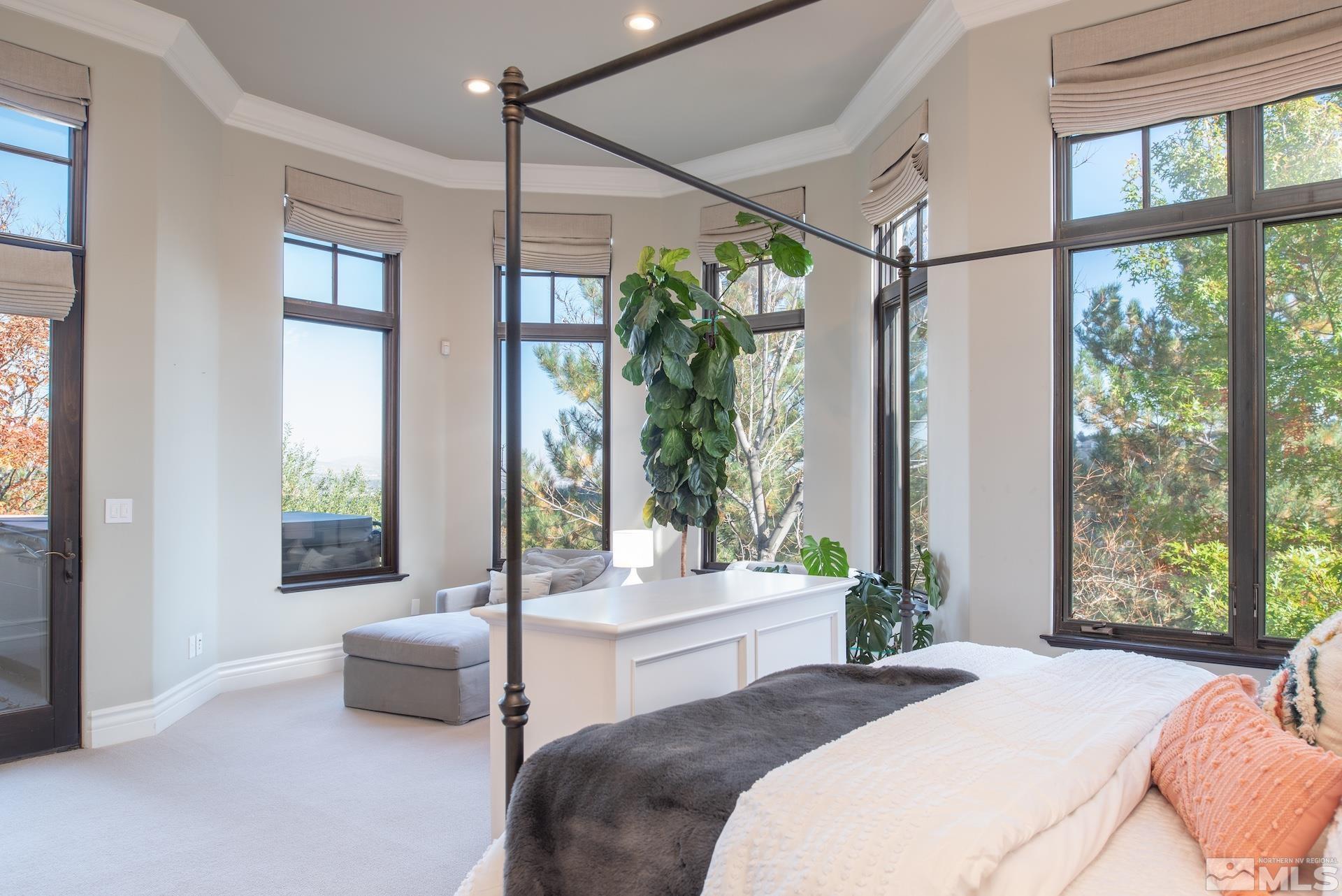 175 Hawken Road Reno, NV 89519 - Photo 19 of 40 a bedroom with a large window and a bed