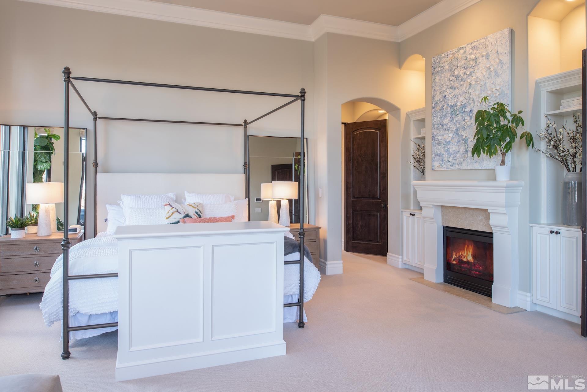 175 Hawken Road Reno, NV 89519 - Photo 20 of 40 a bedroom with a bed and a fireplace