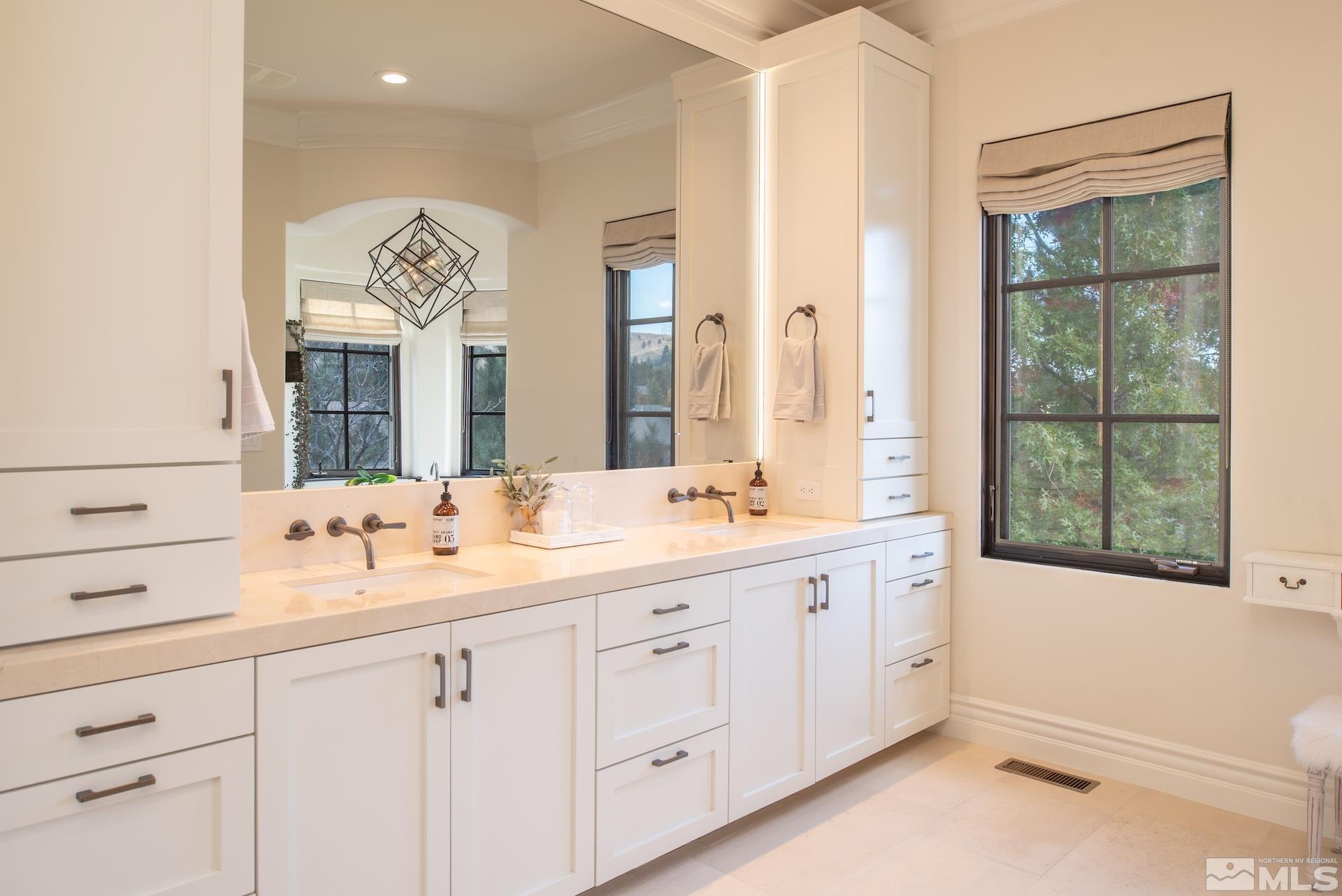 175 Hawken Road Reno, NV 89519 - Photo 21 of 40 a bathroom with a double vanity sink and mirror