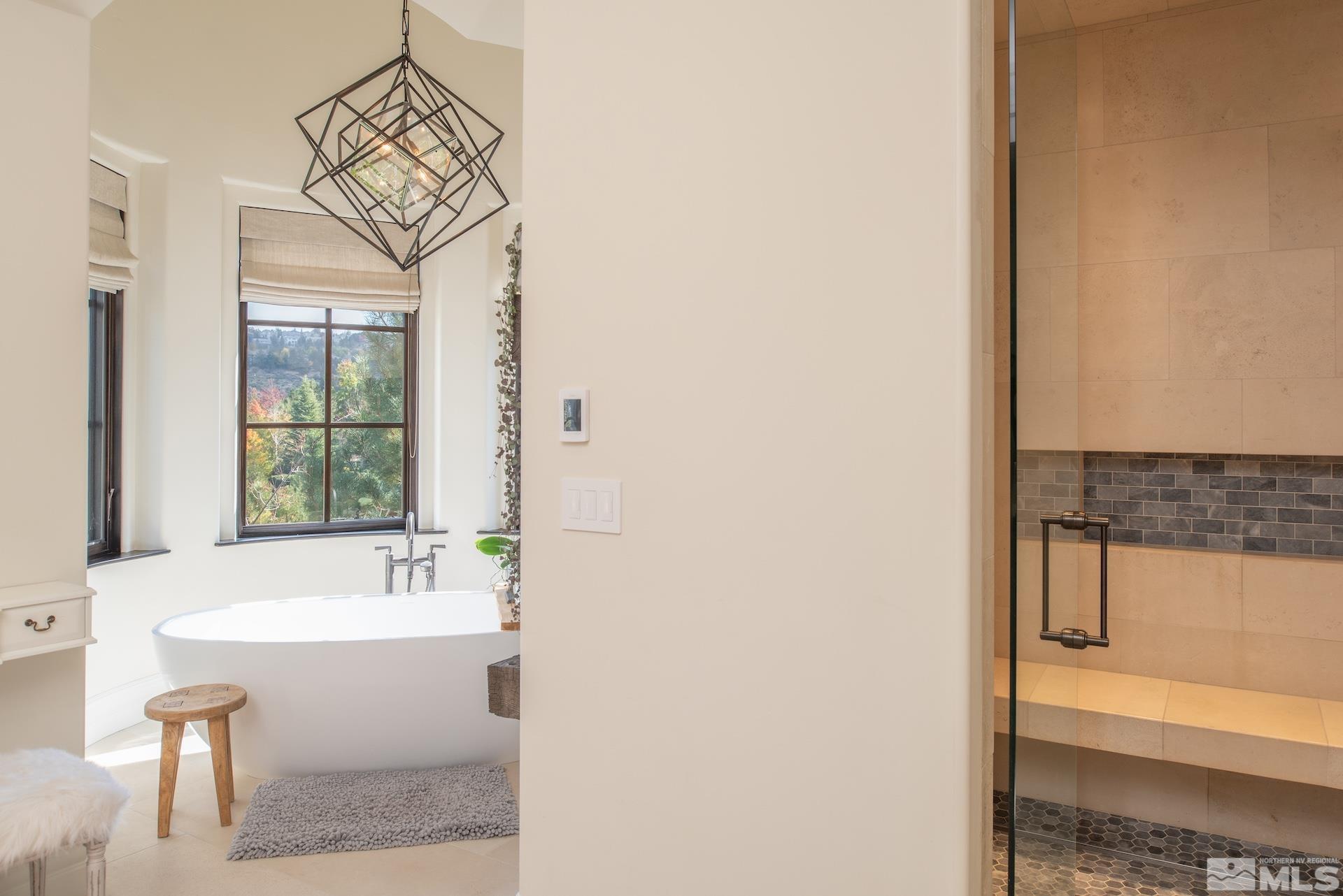 175 Hawken Road Reno, NV 89519 - Photo 23 of 40 a bathroom with a bathtub and a sink