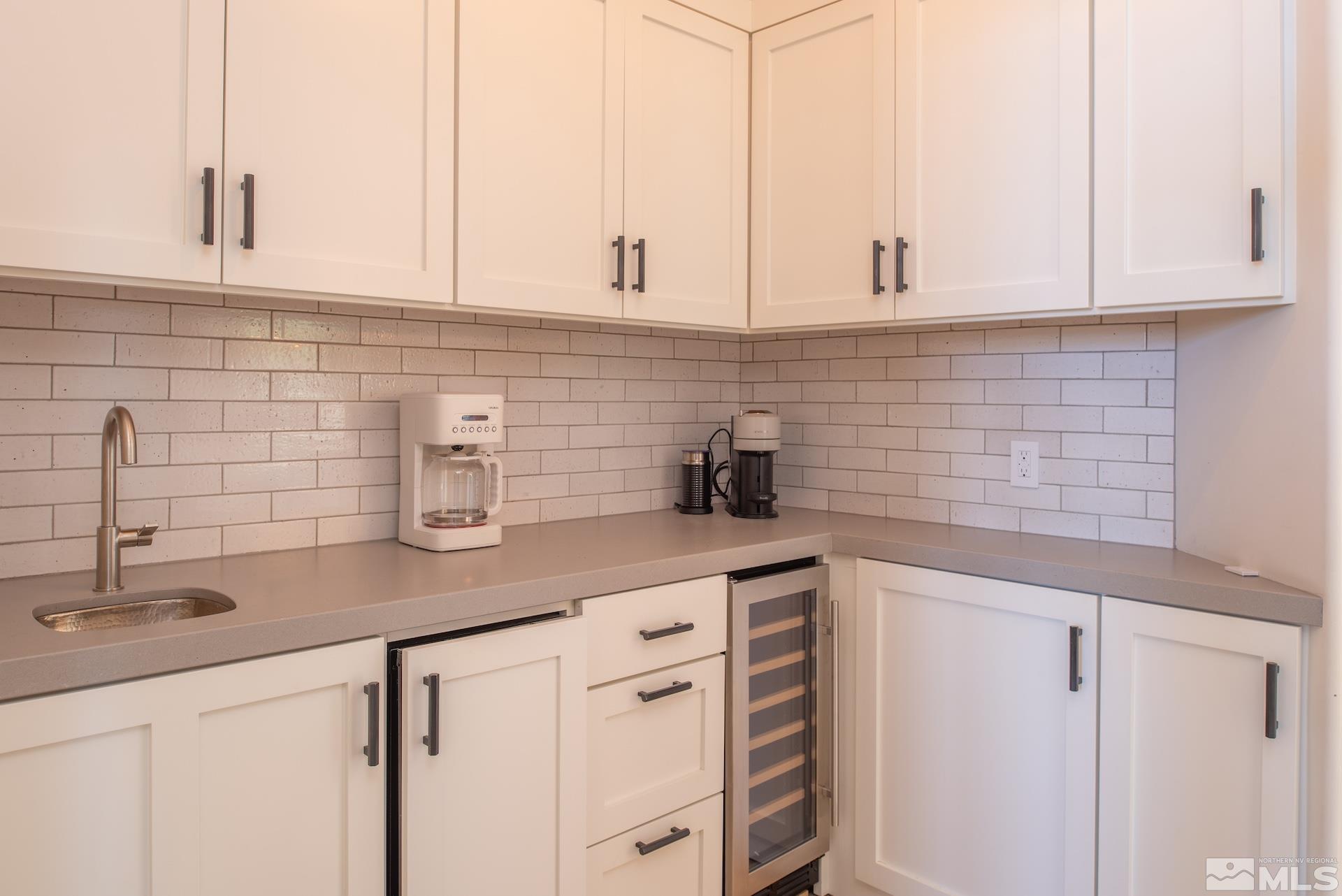 175 Hawken Road Reno, NV 89519 - Photo 29 of 40 a kitchen with stainless steel appliances white cabinets and a sink