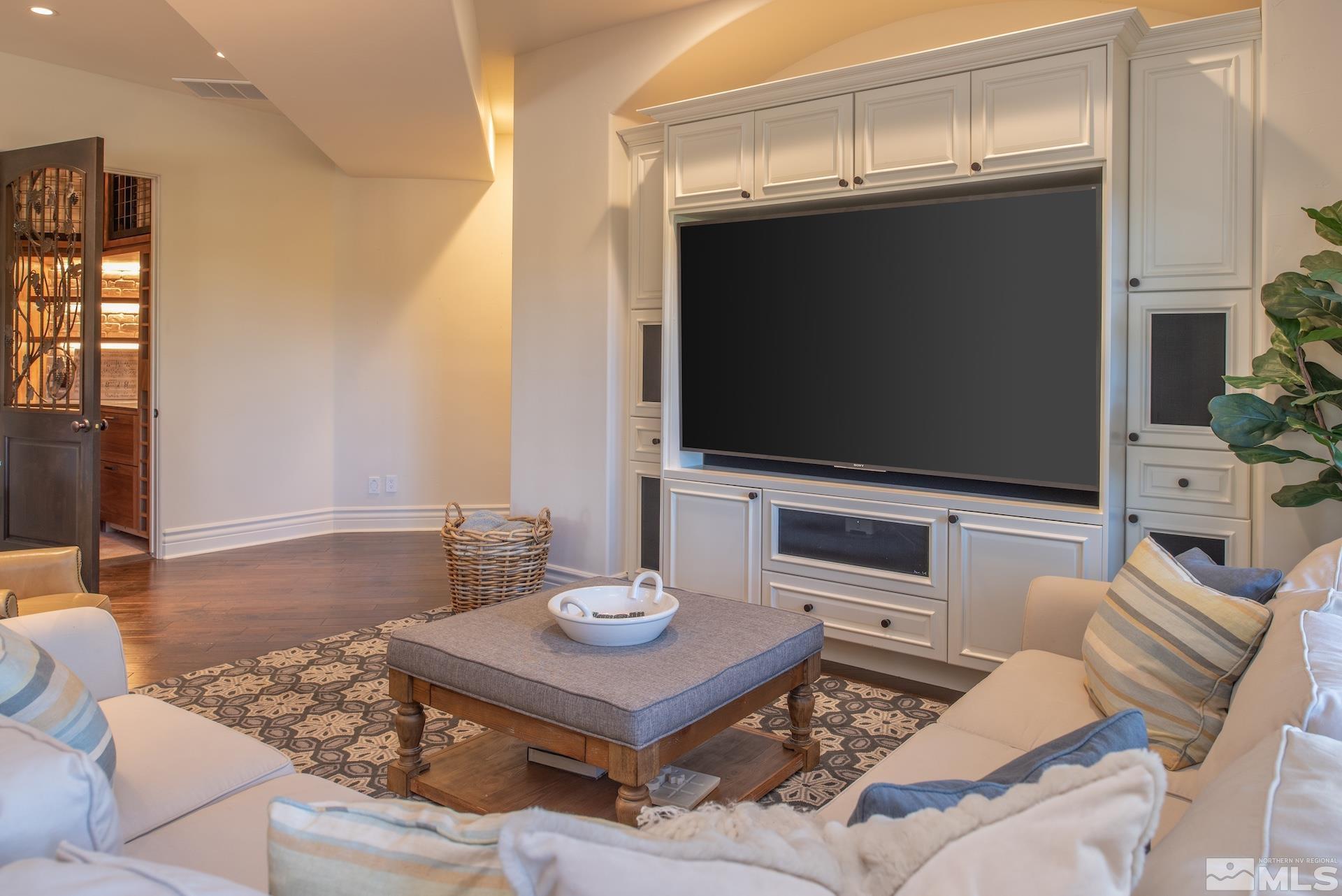 175 Hawken Road Reno, NV 89519 - Photo 34 of 40 a living room with furniture and a flat screen tv