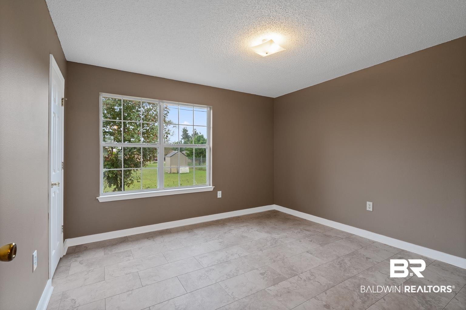16418 Avent Lane Foley, AL 36535 - Photo 29 of 30 Empty room featuring a textured ceiling