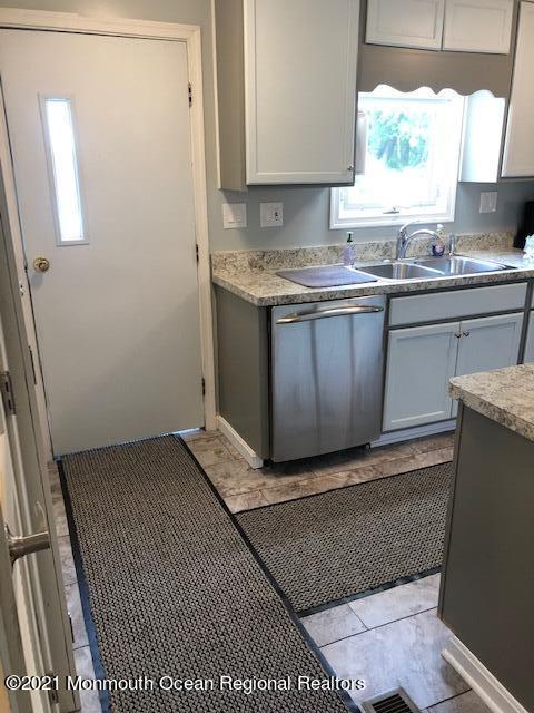 406 Woody Road Freehold, NJ 07728 - Photo 8 of 18 Kitchen Door to Deck