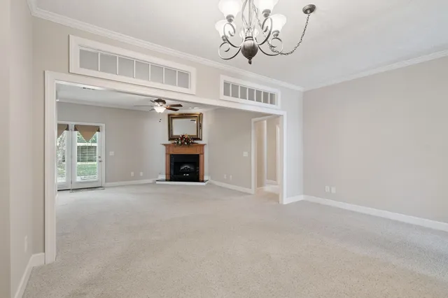a view of empty room with a fireplace