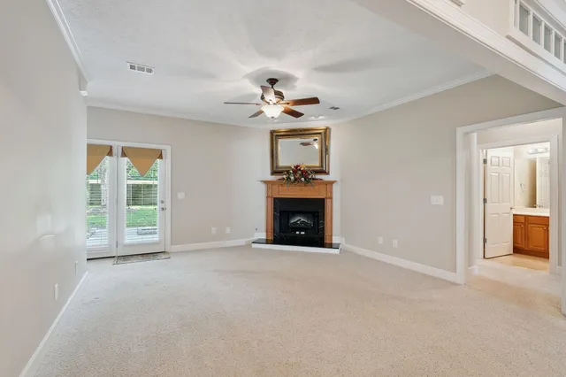 a view of an empty room with a fireplace