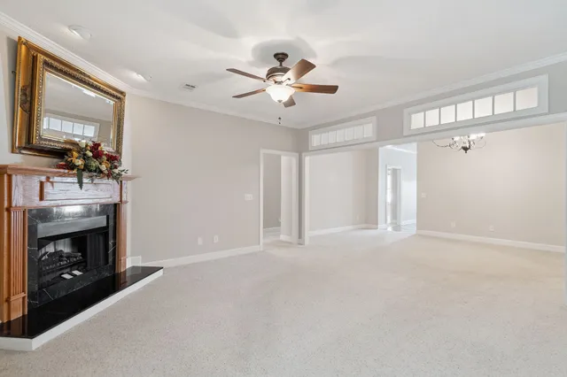 a view of an empty room with a fireplace
