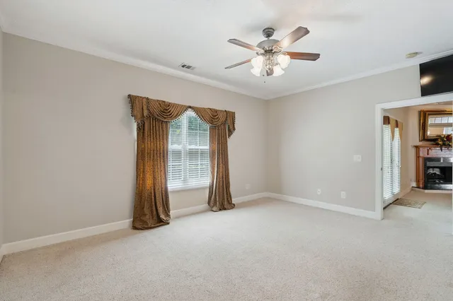 a view of a bathroom with shower and windows