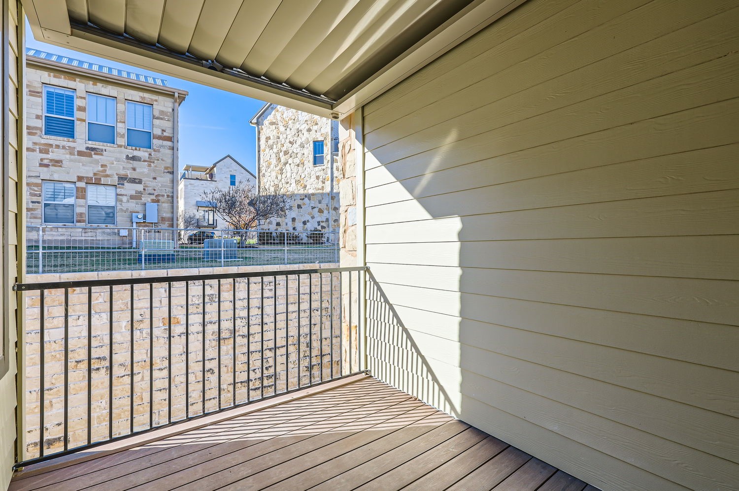 348 Adams Street Georgetown, TX 78628 - Photo 4 of 11 The dining area opens to the covered balcony/sundeck with louvered roof.
