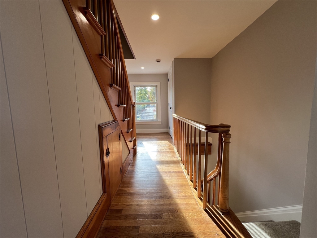 21 Brownville Avenue Ipswich, MA 01938 - Photo 12 of 20 a view of a hallway with wooden floor and staircase