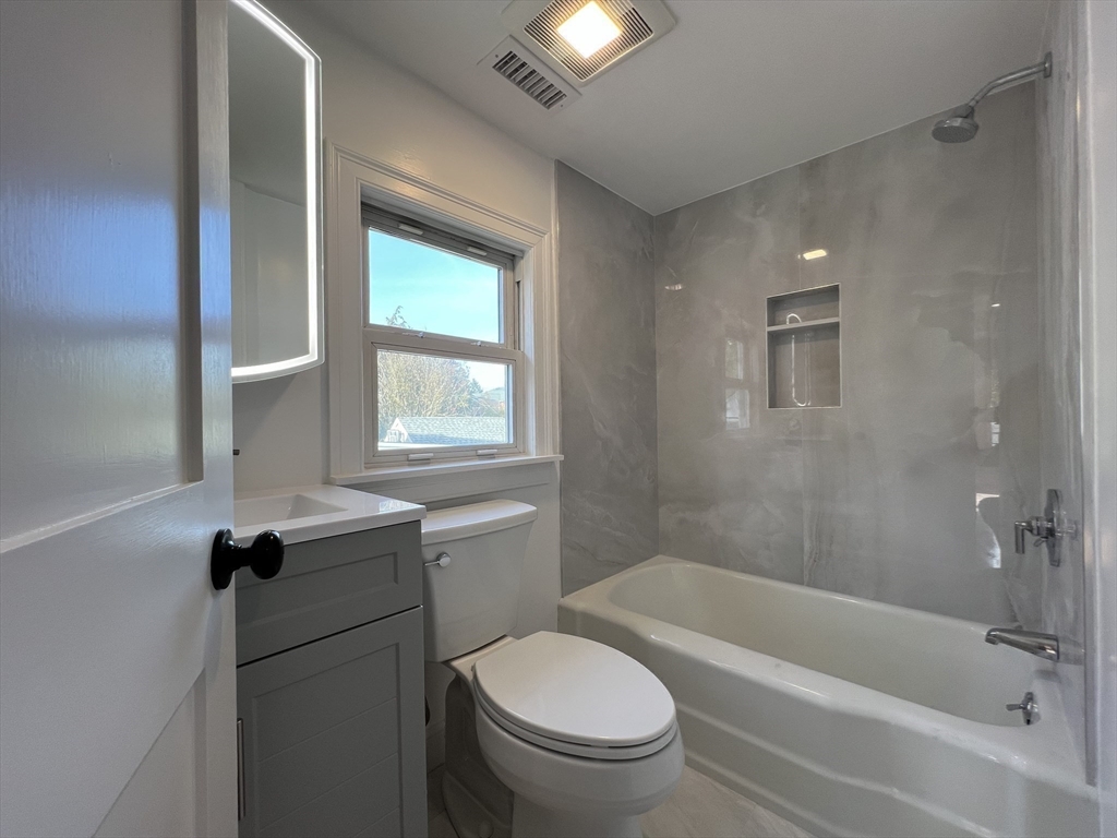 21 Brownville Avenue Ipswich, MA 01938 - Photo 16 of 20 a bathroom with a bathtub toilet and sink
