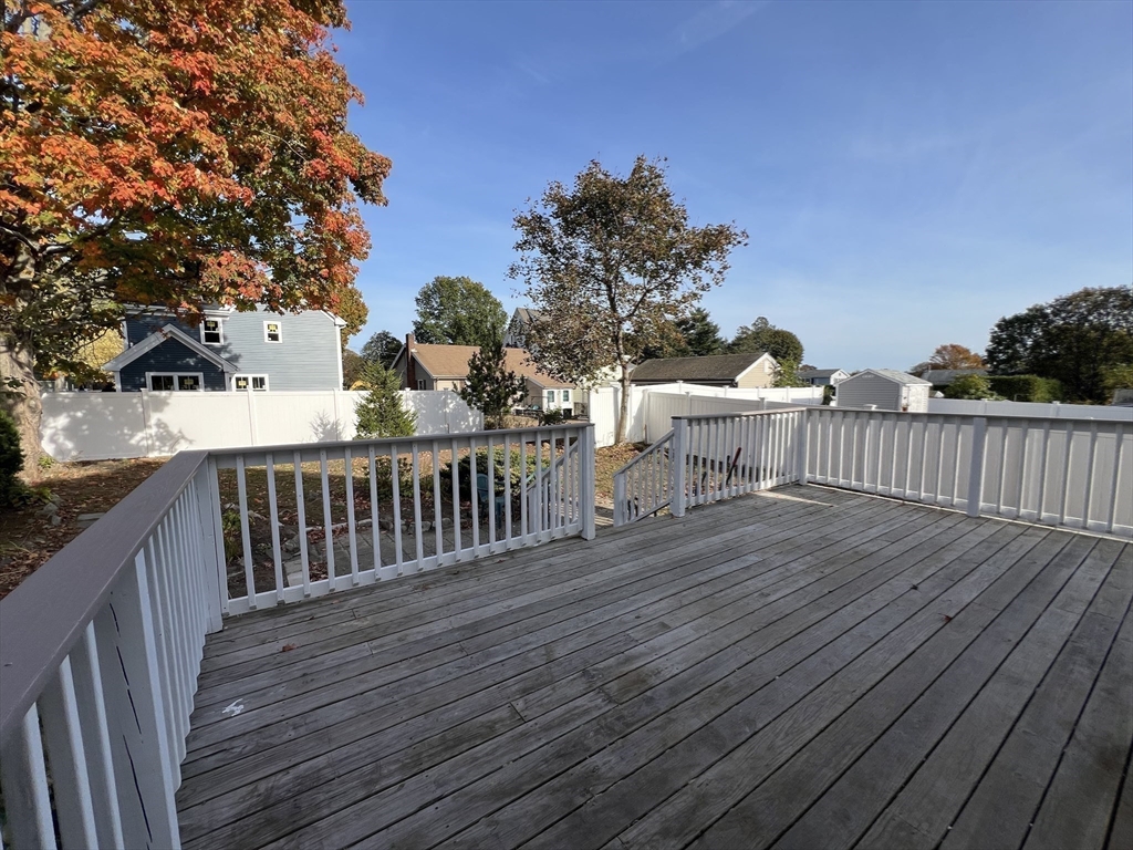 21 Brownville Avenue Ipswich, MA 01938 - Photo 5 of 20 a view of a wooden deck and a backyard