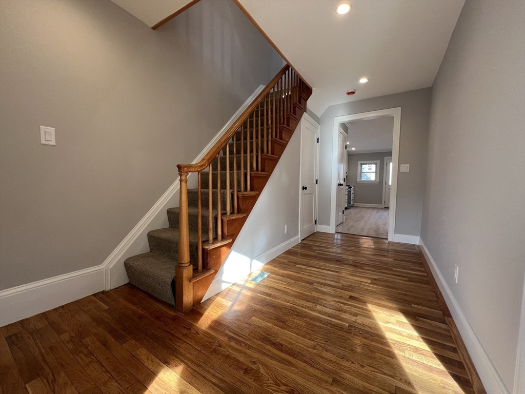 21 Brownville Avenue Ipswich, MA 01938 - Photo 6 of 20 a view of entryway and hall with wooden floor