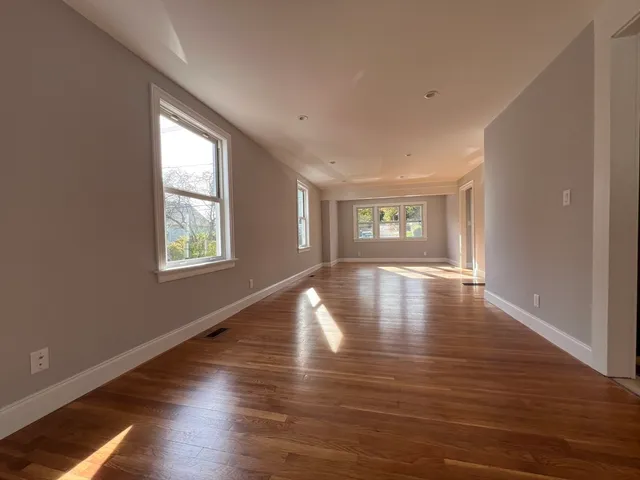 a view of a livingroom with wooden floor