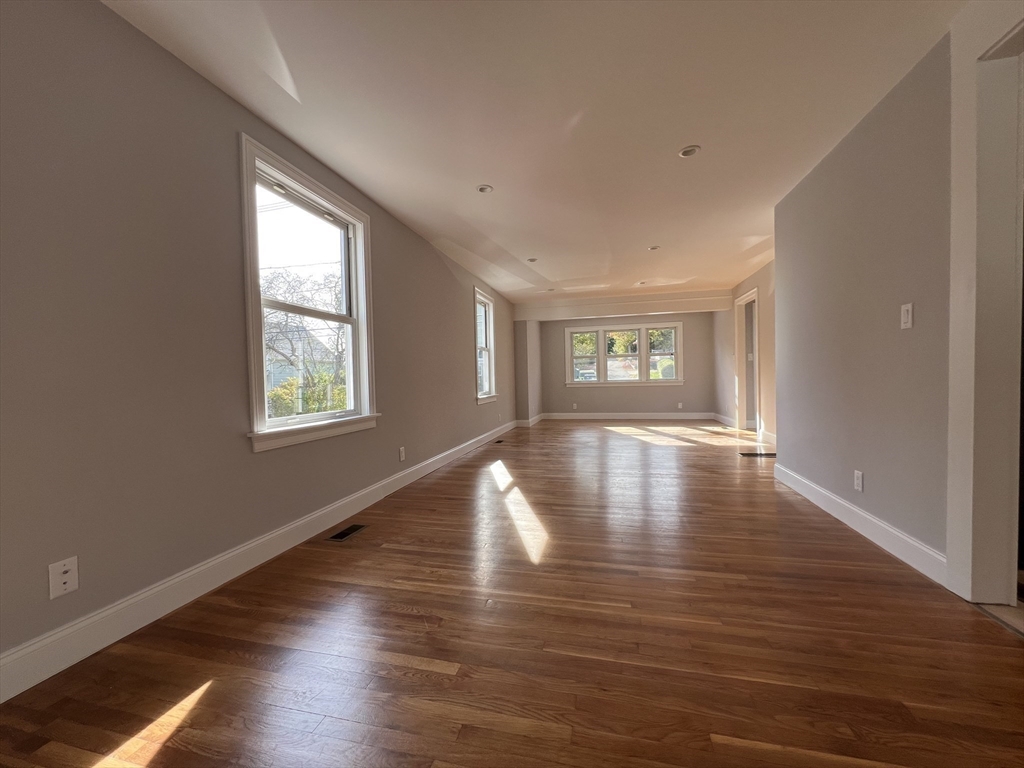 21 Brownville Avenue Ipswich, MA 01938 - Photo 8 of 20 a view of empty room with wooden floor and fan