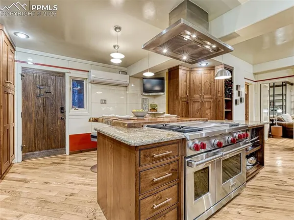 a kitchen with a table and chairs in it