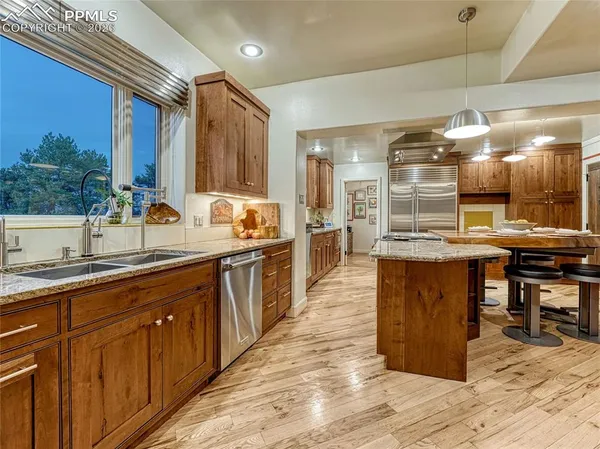 a large kitchen with wooden cabinets and counter space