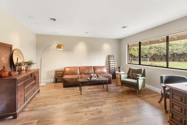 a living room with furniture and a window