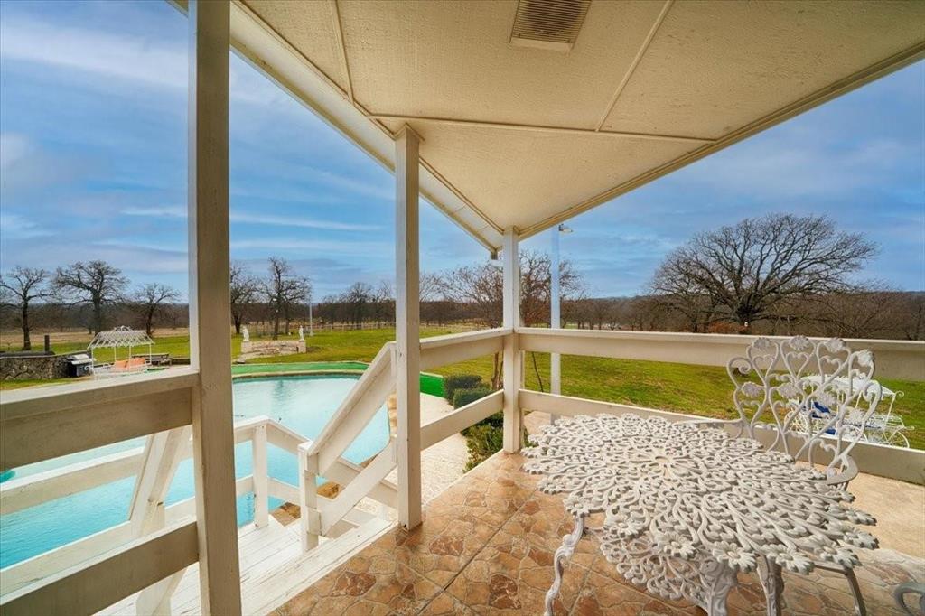 10827 St John Road Pilot Point, TX 76258 - Photo 23 of 40 a view of swimming pool with a couches and lawn chairs