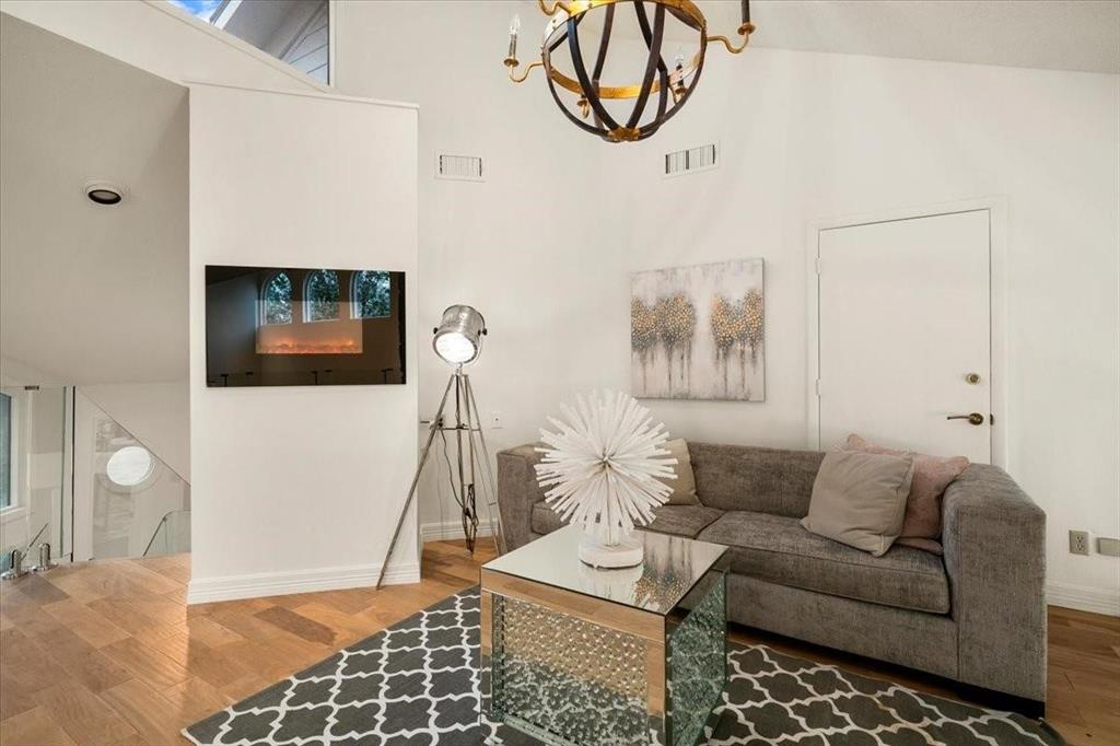 10827 St John Road Pilot Point, TX 76258 - Photo 24 of 40 a living room with furniture and a flat screen tv