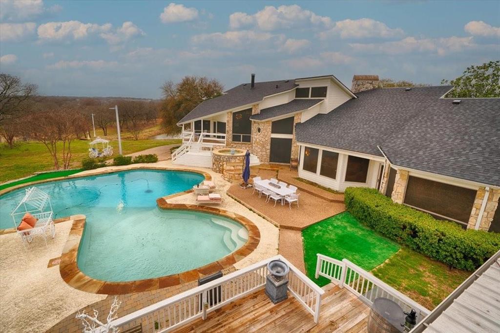 10827 St John Road Pilot Point, TX 76258 - Photo 3 of 40 an aerial view of a house with swimming pool and outdoor seating