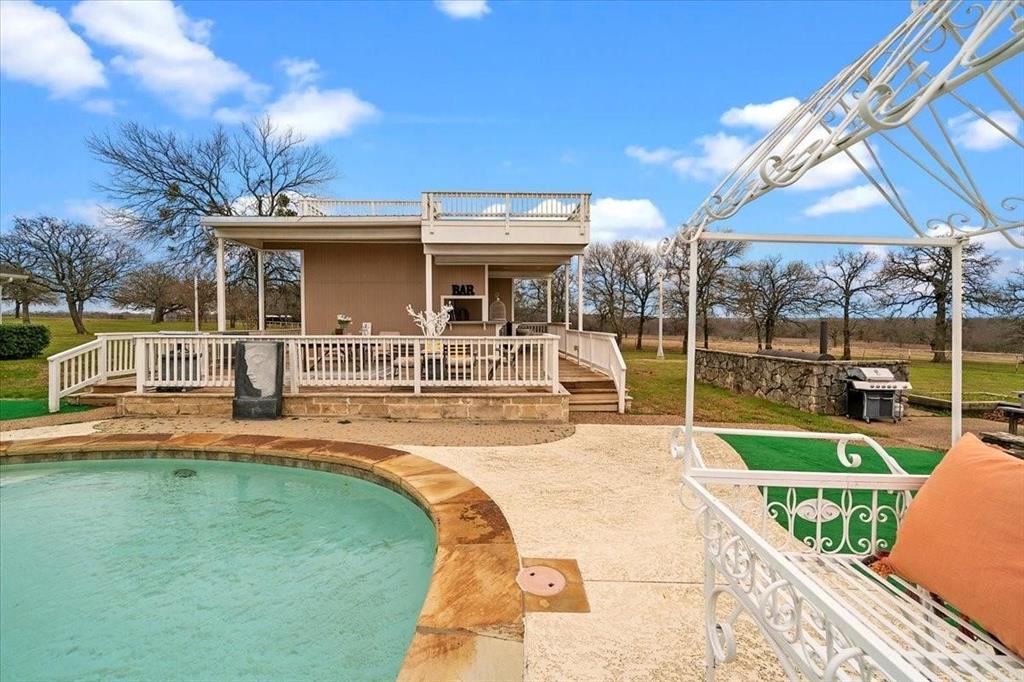 10827 St John Road Pilot Point, TX 76258 - Photo 35 of 40 a view of a house with a swimming pool