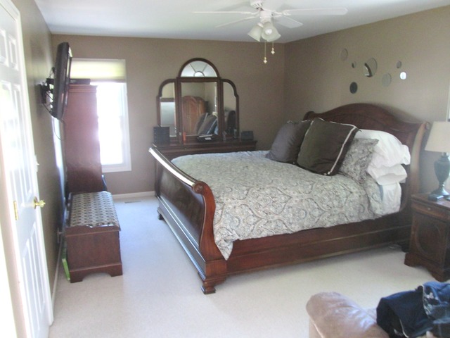 718 Old Hunt Road Fox River Grove, IL 60021 - Photo 12 of 25 a bedroom with a bed and a mirror