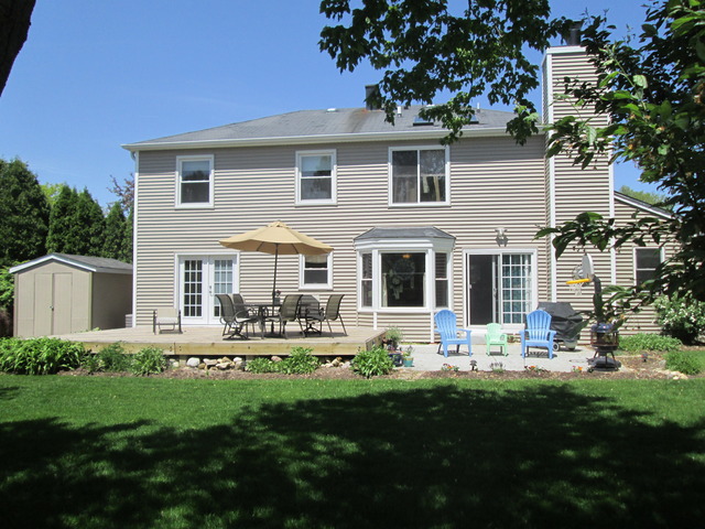 718 Old Hunt Road Fox River Grove, IL 60021 - Photo 24 of 25 a front view of house with yard and outdoor seating