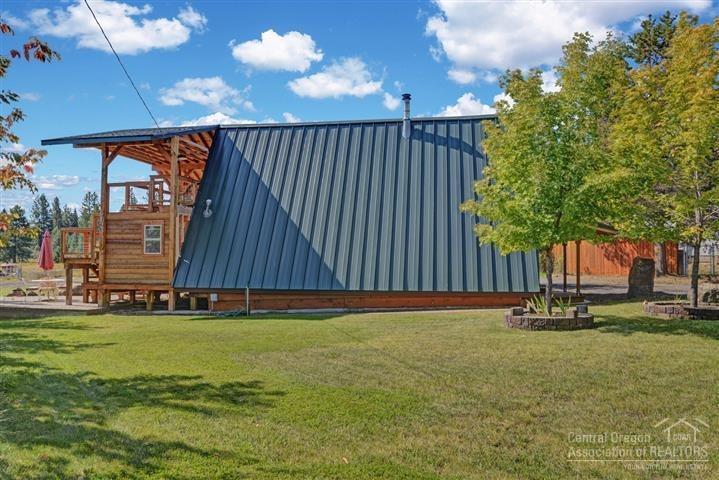 19161 Shoshone Road Bend, OR 97702 - Photo 24 of 25 Side view of A-frame home with new metal