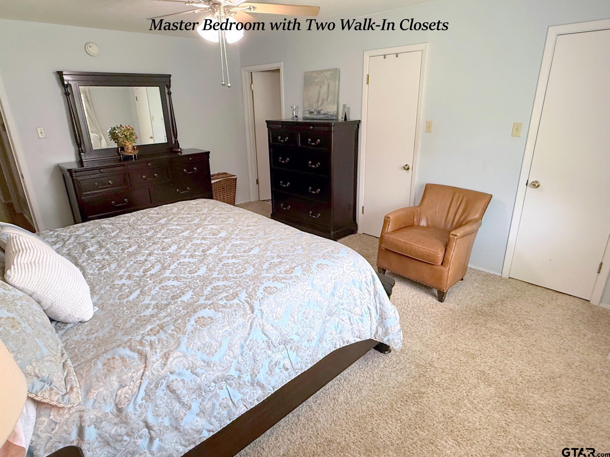 237 Oregon Street Van, TX 75790 - Photo 25 of 44 a bedroom with a bed and dresser with mirror