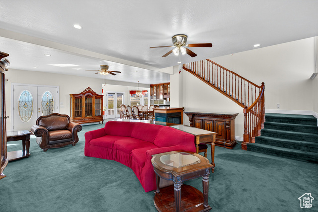 4768 East Hickman Canyon Road Stockton, UT 84071 - Photo 22 of 85 Living area with dark carpet, stairway, recessed lighting, and french doors.