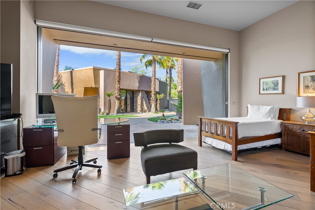 68 Royal St Georges Way Rancho Mirage, CA 92270 - Photo 57 of 75 a living room with furniture and a large window