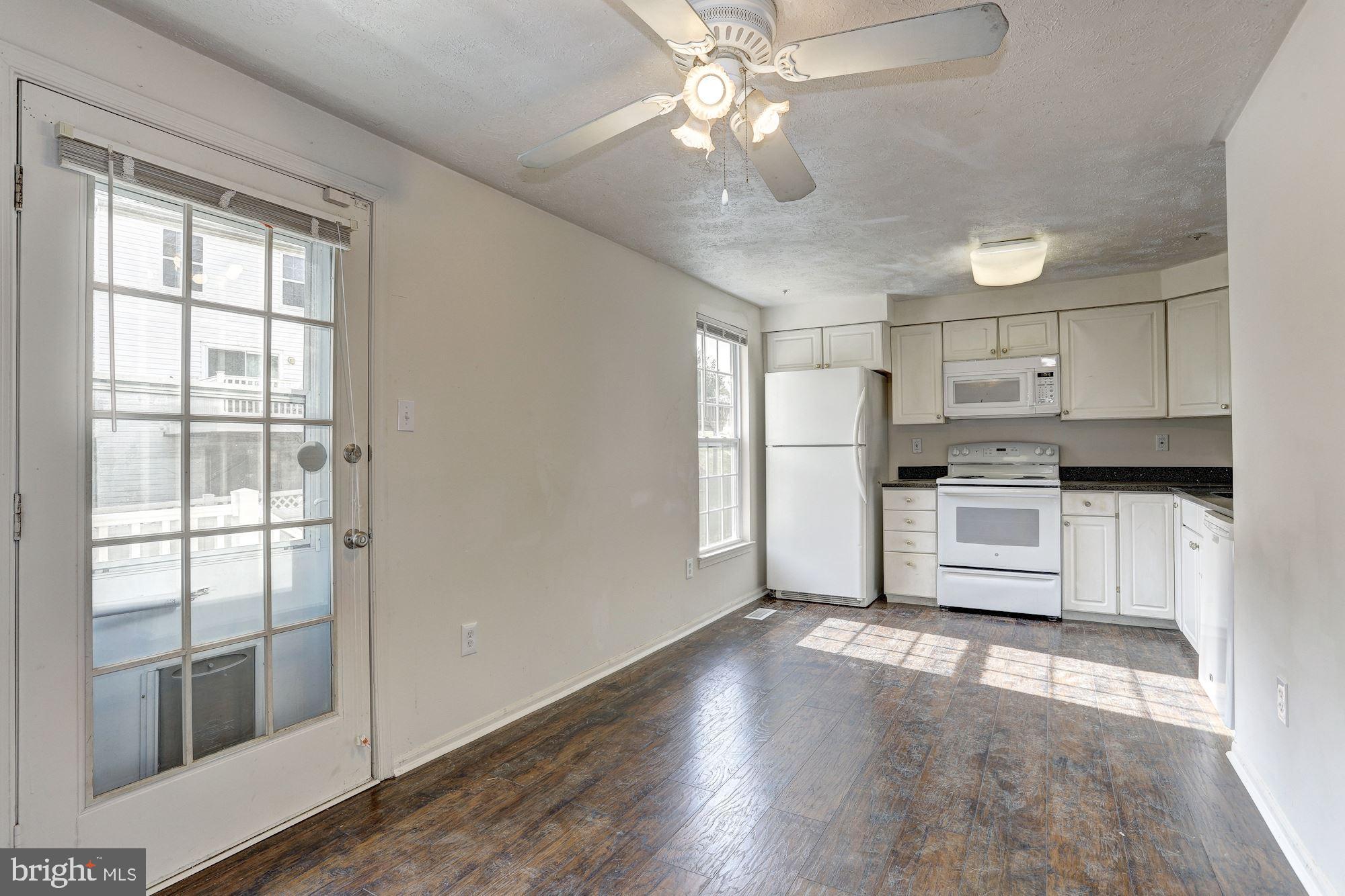 9409 Joleon Road Randallstown, MD 21133 - Photo 3 of 20 All white appliances and granite counters.