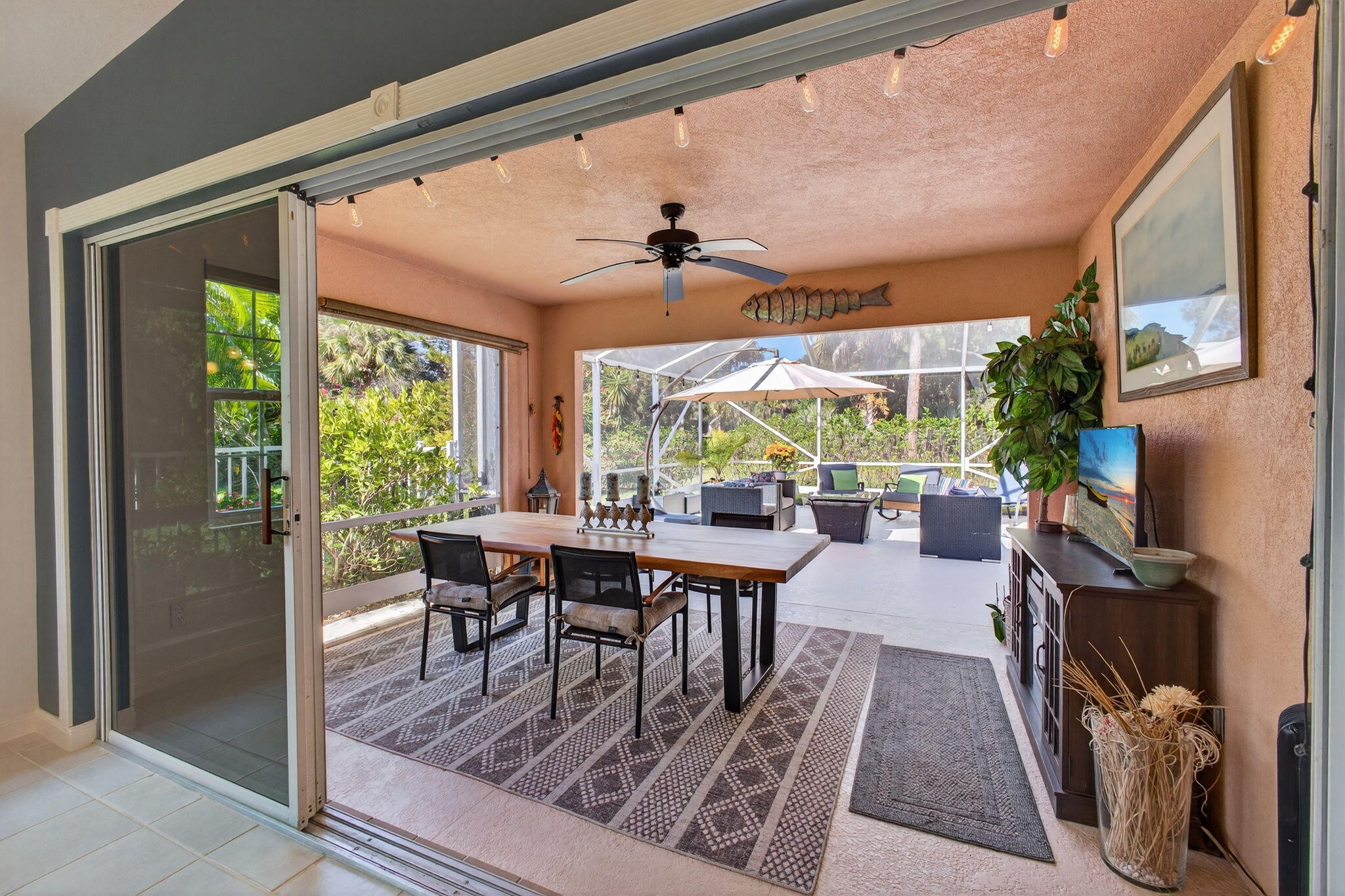 1035 Southwest Tamarrow Place Stuart, FL 34997 - Photo 18 of 42 a view of a dining room with furniture window and outside view