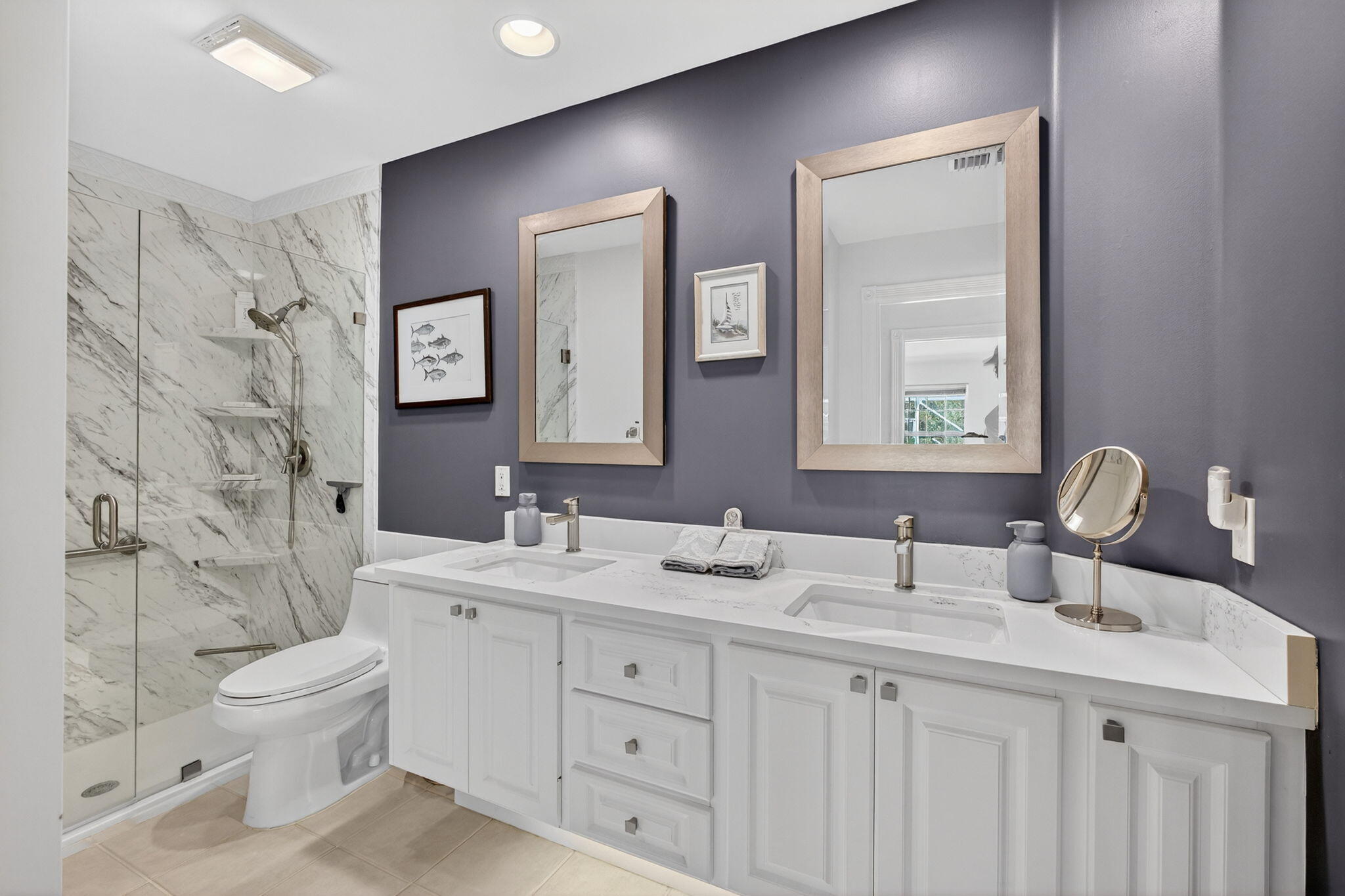 1035 Southwest Tamarrow Place Stuart, FL 34997 - Photo 22 of 42 a bathroom with a double vanity sink toilet mirror and shower