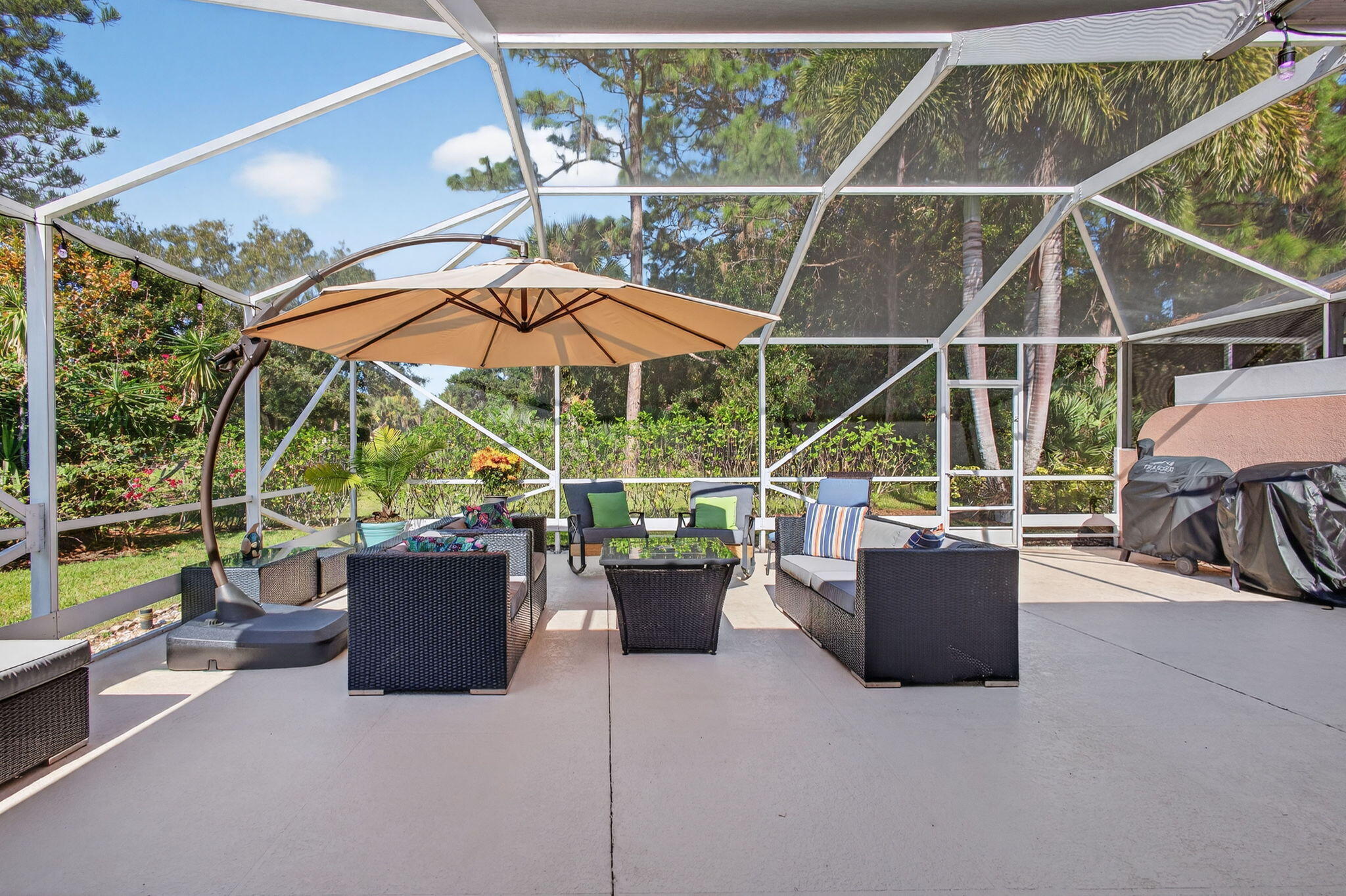 1035 Southwest Tamarrow Place Stuart, FL 34997 - Photo 27 of 42 a view of roof deck with potted plants and furniture