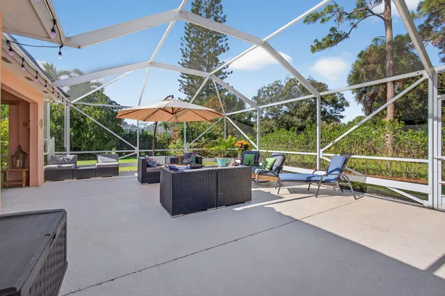 a view of a field with trees around