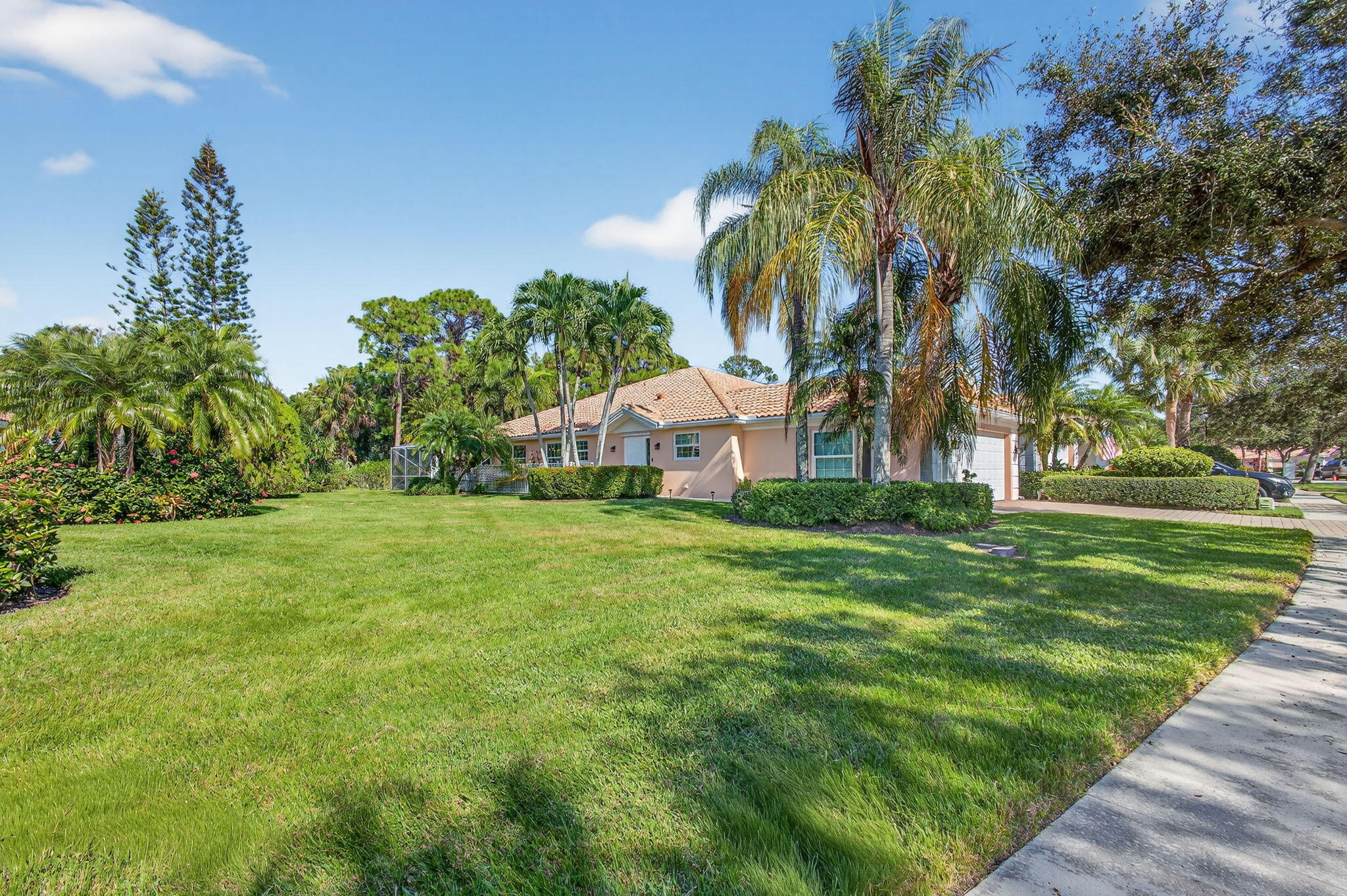 1035 Southwest Tamarrow Place Stuart, FL 34997 - Photo 34 of 42 a view of a house with a yard