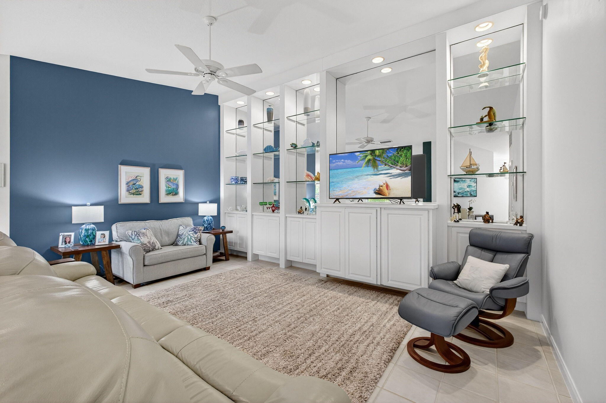 1035 Southwest Tamarrow Place Stuart, FL 34997 - Photo 5 of 42 a living room with furniture and a chandelier